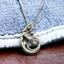 Silver and Opal 'Mother Embracing Child' Pendant Necklace